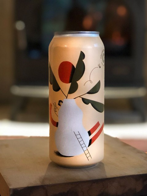 Colourful can of Collective Arts Brewing's Piña Colada Sour beer, sitting on a brown shelf.