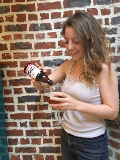 Margot drinking an amber beer